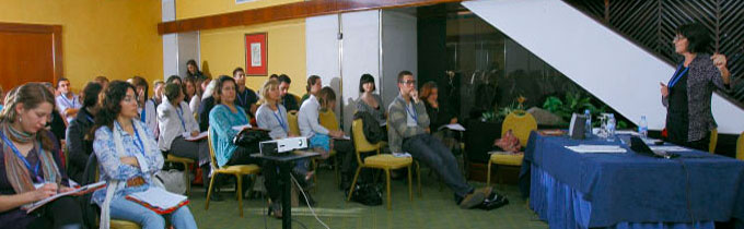 Photo of Annie talking at a conference