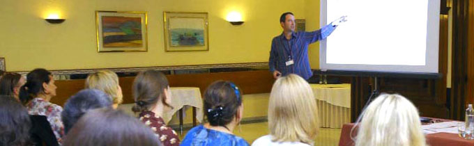 Photo of Mark talking at a conference